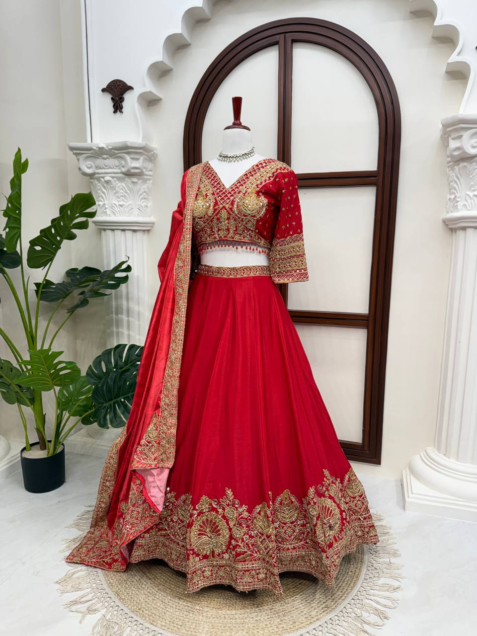 Regal Crimson Red Bridal Lehenga Choli Ensemble Featuring Intricate Gold Zari Embroidery, Heritage Motifs, and Embellished Tassels